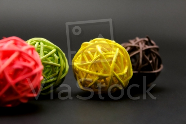Four colored spheres on a black background